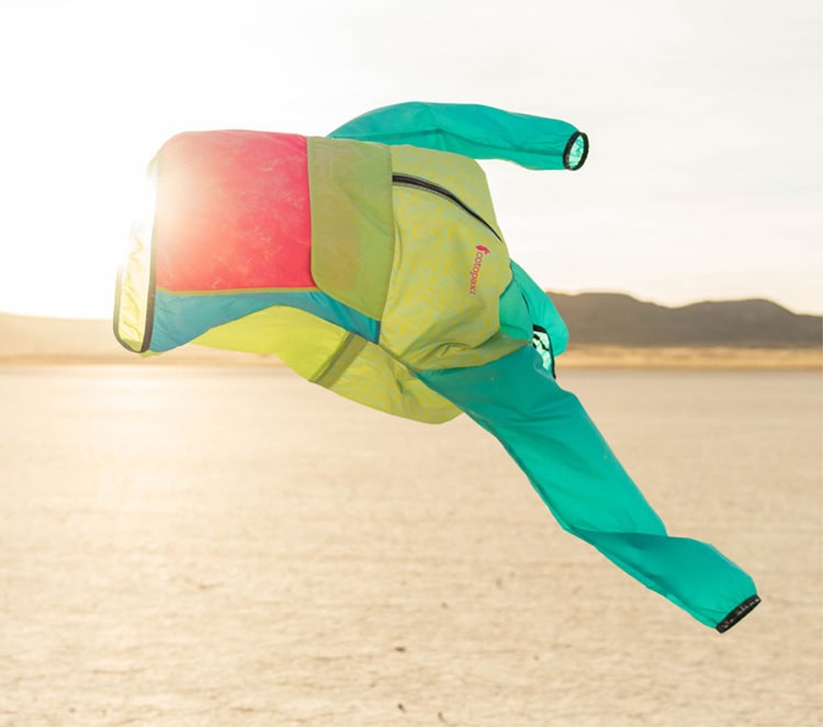 Cotopaxi Windbreaker blowing in the wind.